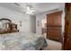 Bedroom with traditional furnishings including a wardrobe and ensuite bathroom at 8424 Regal Way, Palmetto, FL 34221