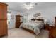 Cozy bedroom features large bed, ceiling fan, and natural light from the window at 8424 Regal Way, Palmetto, FL 34221