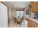 Cozy breakfast nook with sliding glass doors to the patio and comfortable seating for four at 8424 Regal Way, Palmetto, FL 34221