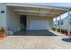 Exterior view of the carport and garage, providing covered parking and convenience at 8424 Regal Way, Palmetto, FL 34221