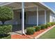 The carport is spacious with an attached garage, manicured landscaping, and room for parking at 8424 Regal Way, Palmetto, FL 34221