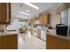 Spacious kitchen with modern appliances and seamless flow into the dining area, great for entertaining at 8424 Regal Way, Palmetto, FL 34221