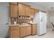Functional kitchen with bright cabinets, neutral counters, and all-white appliances at 8424 Regal Way, Palmetto, FL 34221