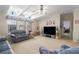 Bright living room features high ceilings, ceiling fan, TV, and comfortable seating area at 8424 Regal Way, Palmetto, FL 34221