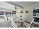 Relaxing sunroom featuring comfortable seating, ceiling fan, and plenty of natural light at 8424 Regal Way, Palmetto, FL 34221