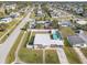 Aerial view of a home with a fenced backyard and an above-ground pool at 8798 Herbison Ave, North Port, FL 34287