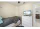 Comfortable bedroom with a white dresser, a TV and tile flooring at 8798 Herbison Ave, North Port, FL 34287