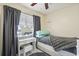 Cozy bedroom featuring a lighted vanity, comfortable bed, and charming star-patterned ceiling at 8798 Herbison Ave, North Port, FL 34287