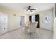 Dining room with stylish tile flooring, elegant table set, and bright natural light at 8798 Herbison Ave, North Port, FL 34287