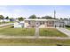 Charming single-story home with well-maintained front lawn and mature landscaping at 8798 Herbison Ave, North Port, FL 34287