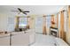 Inviting living room with tile floors, cozy fireplace, and abundant natural light at 8798 Herbison Ave, North Port, FL 34287