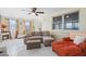 Comfortable living room with a large sectional sofa, fireplace, and tile flooring throughout at 8798 Herbison Ave, North Port, FL 34287