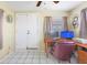 Functional home office area with a wooden desk, computer setup, and neutral walls at 8798 Herbison Ave, North Port, FL 34287