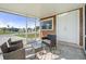 Relaxing screened patio featuring comfortable seating and outdoor access at 8798 Herbison Ave, North Port, FL 34287