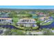 Expansive aerial view of the community with lakes, golf course, tennis court and lush greenery at 9620 Club South Cir # 5306, Sarasota, FL 34238