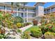Beautiful condo exterior with lush landscaping, walkway and well-maintained facade at 9620 Club South Cir # 5306, Sarasota, FL 34238