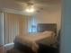 Comfortable bedroom with carpet, a ceiling fan, and a closet at 965 Whitman Dr, Sarasota, FL 34243