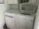 Laundry room featuring a washer and dryer, perfect for convenience at 965 Whitman Dr, Sarasota, FL 34243
