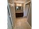 Bathroom with vanity, mirror, and tile flooring at 5691 Bentgrass Dr # 15-102, Sarasota, FL 34235