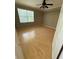 Bedroom featuring laminate wood flooring, neutral walls, and large window at 5691 Bentgrass Dr # 15-102, Sarasota, FL 34235