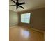 Bedroom with hardwood floors and bright window at 5691 Bentgrass Dr # 15-102, Sarasota, FL 34235