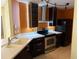 Kitchen featuring stainless steel appliances and tile floors at 5691 Bentgrass Dr # 15-102, Sarasota, FL 34235