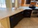 Kitchen island with granite countertop and tile floor at 5691 Bentgrass Dr # 15-102, Sarasota, FL 34235