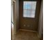 Small nook area with a window with blinds, tile floors, and electrical outlets at 5691 Bentgrass Dr # 15-102, Sarasota, FL 34235