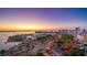 Breathtaking aerial view of the cityscape and marina at sunset with colorful sky reflecting on the water at 101 S Gulfstream Ave. # 9C, Sarasota, FL 34236