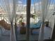 Cozy balcony with comfortable seating and charming curtains overlooking the city at 101 S Gulfstream Ave. # 9C, Sarasota, FL 34236