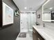 Modern bathroom featuring shower with glass door, contemporary vanity with stylish backsplash and fixtures at 101 S Gulfstream Ave. # 9C, Sarasota, FL 34236