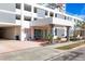 Exterior shot of the building's entrance showcasing modern architecture and clean landscaping at 101 S Gulfstream Ave. # 9C, Sarasota, FL 34236