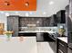 Contemporary kitchen with dark wood cabinets, stainless steel appliances, and a center island at 101 S Gulfstream Ave. # 9C, Sarasota, FL 34236