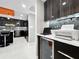 Stylish kitchen with stainless steel appliances, wine cooler, and custom cabinetry at 101 S Gulfstream Ave. # 9C, Sarasota, FL 34236