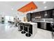 Bright, open-concept kitchen with island seating, modern finishes, and contemporary lighting at 101 S Gulfstream Ave. # 9C, Sarasota, FL 34236