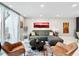 Comfortable living area with a contemporary sofa, accent chairs, and bright natural light at 101 S Gulfstream Ave. # 9C, Sarasota, FL 34236