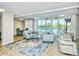 Relax in the lounge area with plush seating, pool access, and bright natural light at 101 S Gulfstream Ave. # 9C, Sarasota, FL 34236