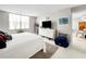 Bright main bedroom with sleek white dresser and decorative throw pillows at 101 S Gulfstream Ave. # 9C, Sarasota, FL 34236