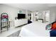 Main bedroom featuring walk-in closet, en suite bathroom, and neutral paint at 101 S Gulfstream Ave. # 9C, Sarasota, FL 34236