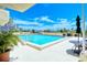 Stunning rooftop pool with clear blue water and city skyline views offering an oasis at 101 S Gulfstream Ave. # 9C, Sarasota, FL 34236