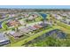 Aerial view showcasing the community layout with winding waterways and meticulously landscaped properties at 11037 77Th E St, Parrish, FL 34219