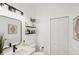Clean bathroom featuring sleek black hardware, white walls, and a spacious feel at 11037 77Th E St, Parrish, FL 34219