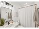 Modern bathroom with sleek fixtures, stylish decor, and a shower with a curtain at 11037 77Th E St, Parrish, FL 34219