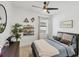 Cozy bedroom with a comfortable bed, ceiling fan, and decorative wall art at 11037 77Th E St, Parrish, FL 34219