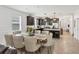 Open dining area with a breakfast bar, stainless steel appliances, and a dining table at 11037 77Th E St, Parrish, FL 34219