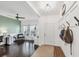 Bright and inviting foyer featuring hardwood floors, a cozy bench, and a decorative coat rack at 11037 77Th E St, Parrish, FL 34219
