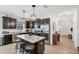 Modern kitchen with stainless steel appliances, granite countertops, and a stylish island with barstool seating at 11037 77Th E St, Parrish, FL 34219