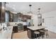 Well-equipped kitchen with stainless steel appliances, pendant lighting, and granite countertops at 11037 77Th E St, Parrish, FL 34219