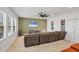 Spacious living room with a comfortable sectional sofa and large windows for natural light at 11037 77Th E St, Parrish, FL 34219