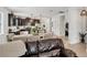 Open-concept living and dining area features a spacious layout and seamless flow to the kitchen with stainless appliances at 11037 77Th E St, Parrish, FL 34219